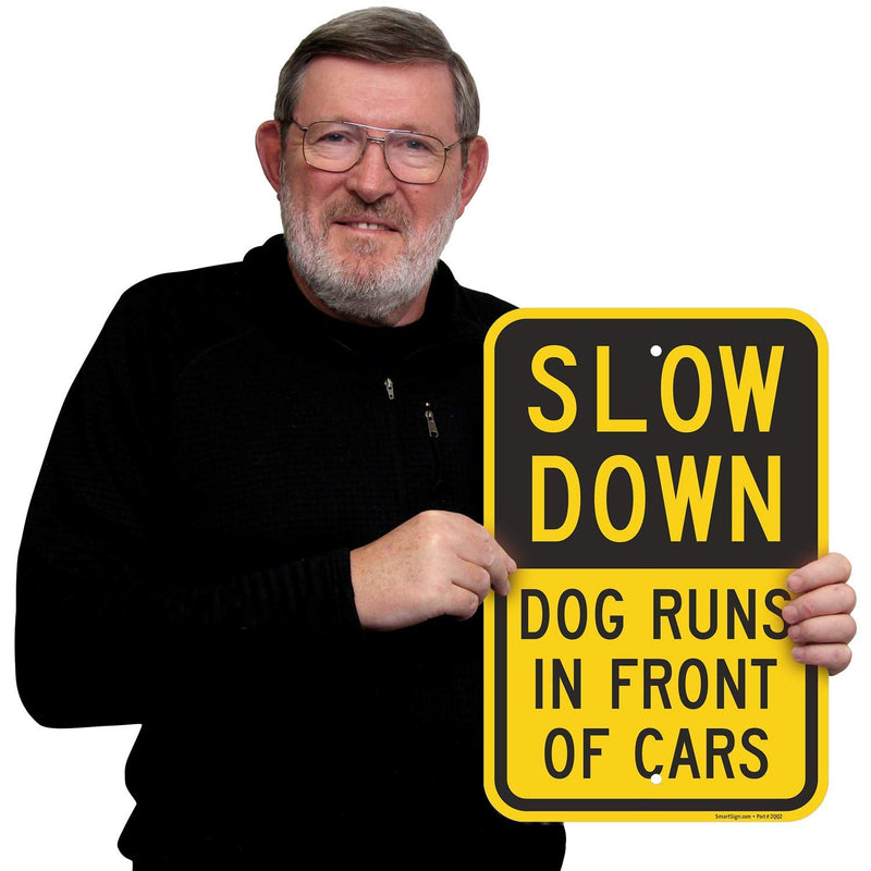 SmartSign - K-9324-AL-12x18 "Slow Down - Dog Runs In Front Of Cars" Sign | 12" x 18" Aluminum Black on Yellow